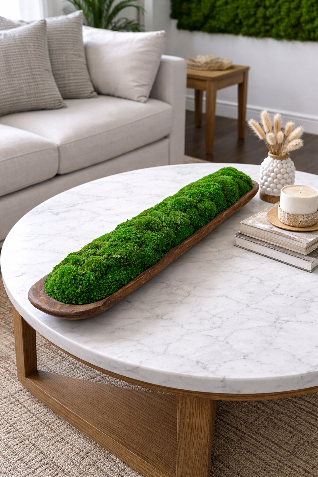 Preserved moss bowl centerpiece styled on a dining table